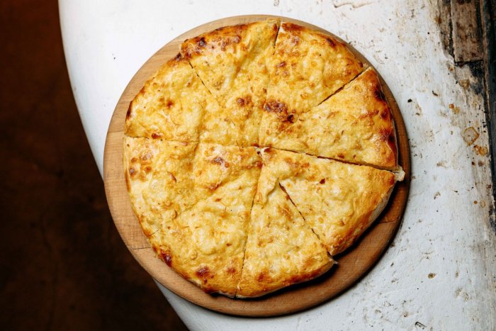 Khachapuri in Mingrelian style with smoked cheese